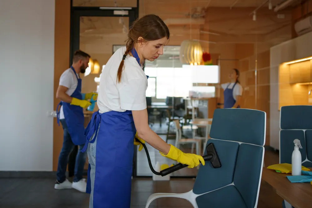Professional cleaning service people working together in an office_converted