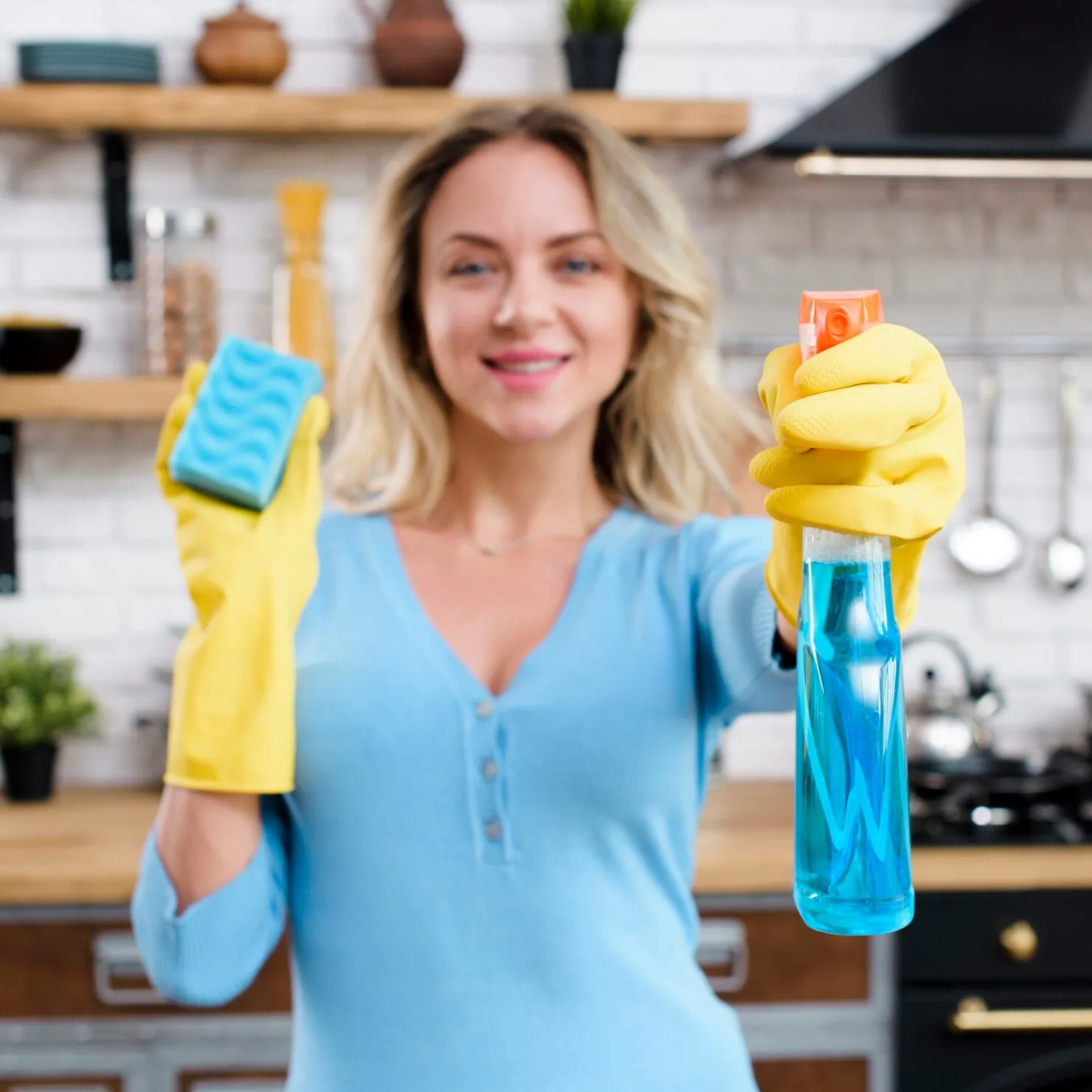 smiling-woman-wearing-rubber-gloves-holding-detergent-with-sponge_23-2148222220_converted